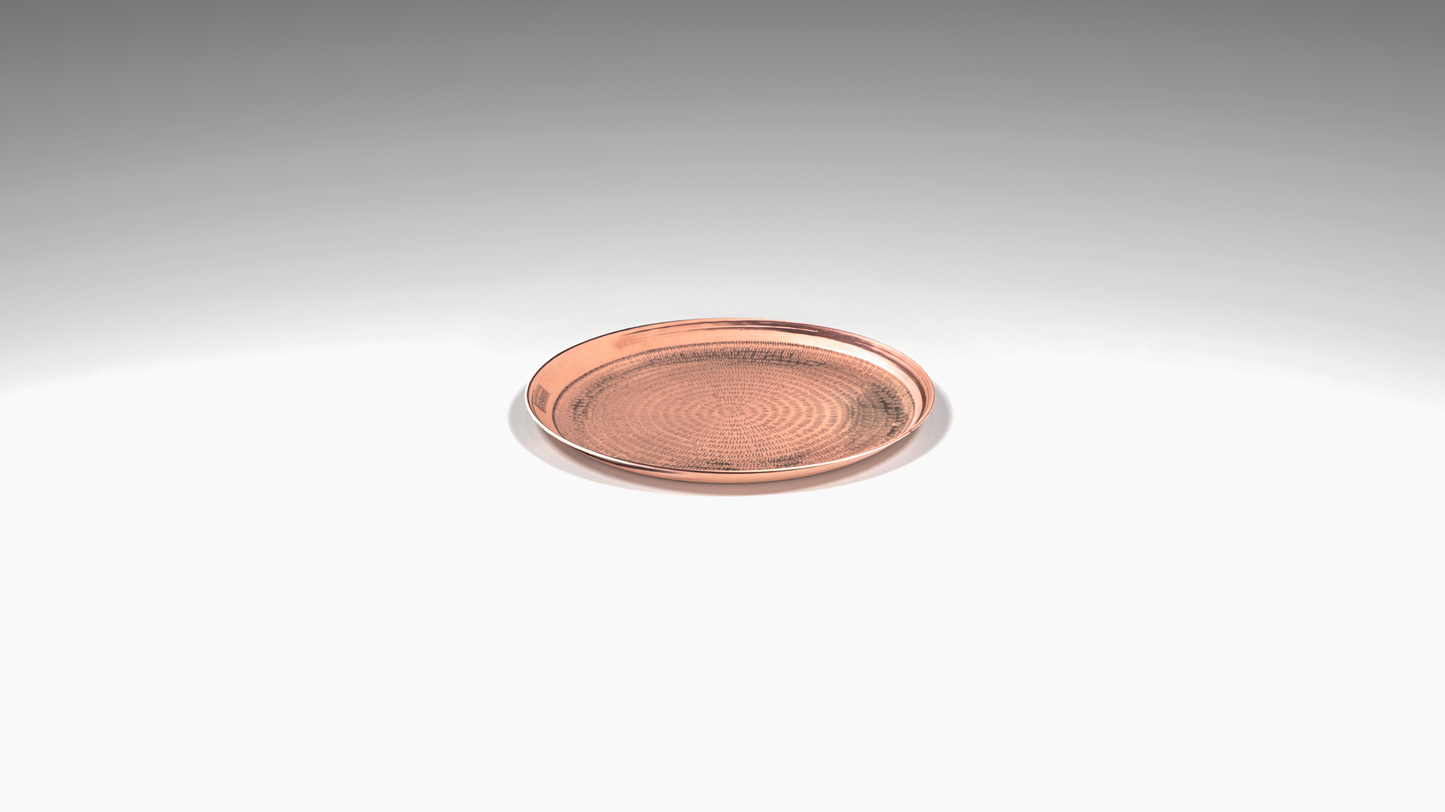 Round copper tray with sand texture