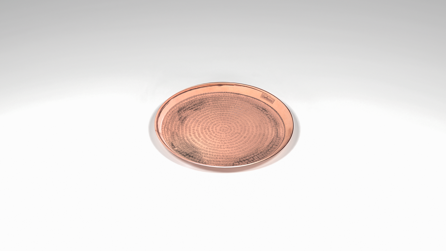 Round copper tray with sand texture