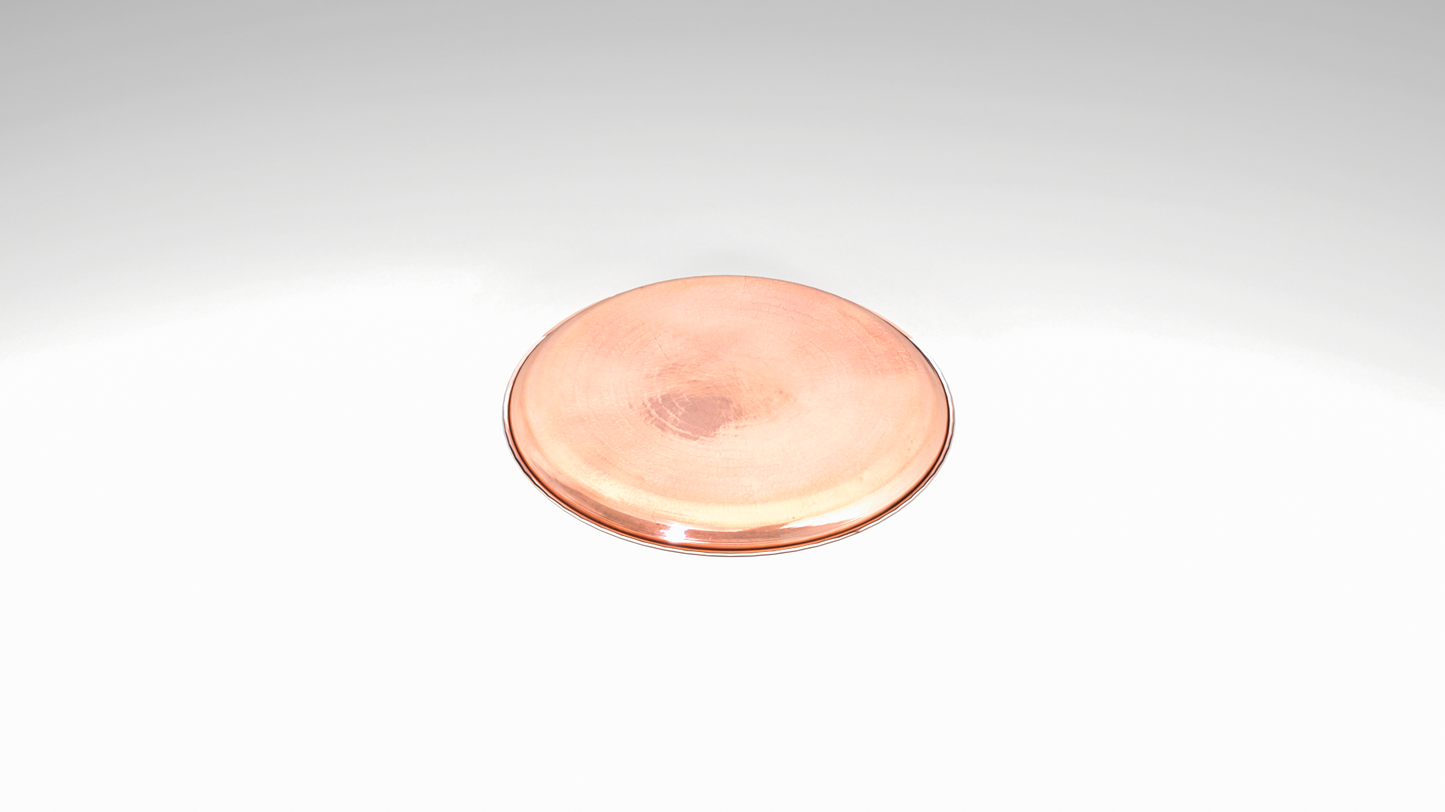 Round copper tray with sand texture